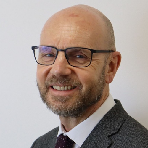 Chris James smiling at the camera